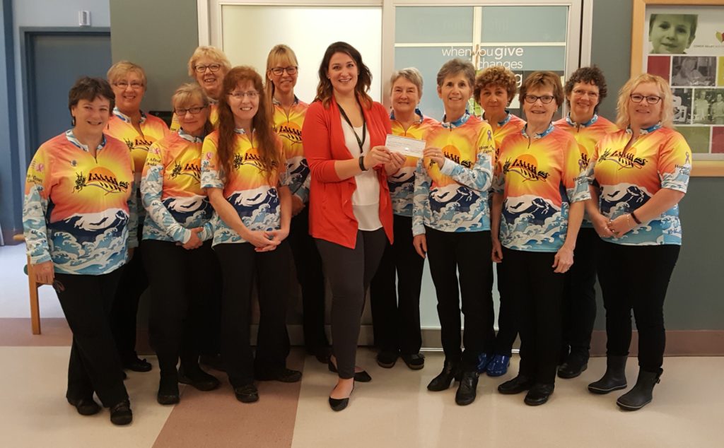 Teammates of the Hope Afloat Canada's dragon boat team present a cheque for $2,300 to the Comox Valley Healthcare Foundation on Friday, Oct. 28. Proceeds from their annual Tag Day go to the Cancer Care Unit at St. Joseph's Hospital. 